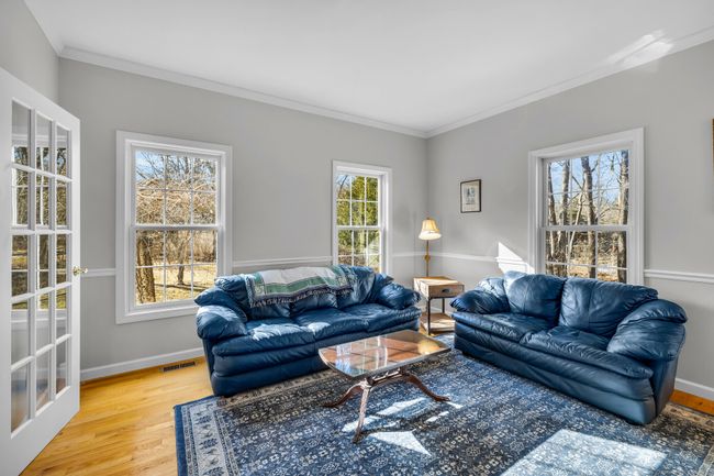 Living room accessed via French doors. Leads to family room. | Image 6