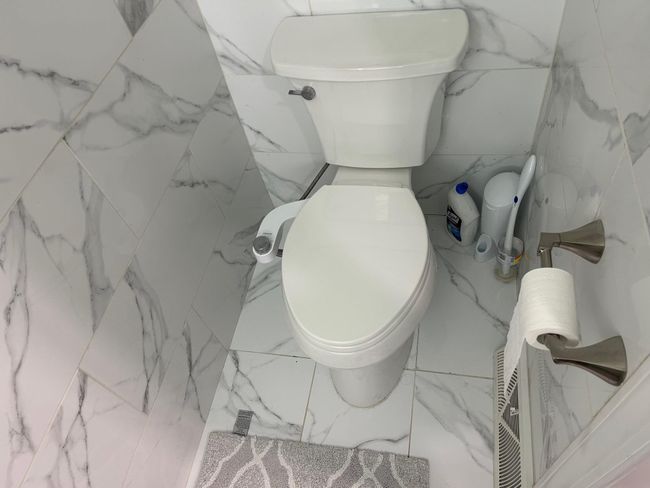 Bathroom with toilet and marble finish flooring | Image 29