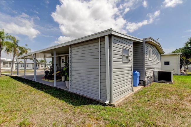 63. Northern Side of Home.. Showing Walls of Storage & Laundry Shed.. | Image 62