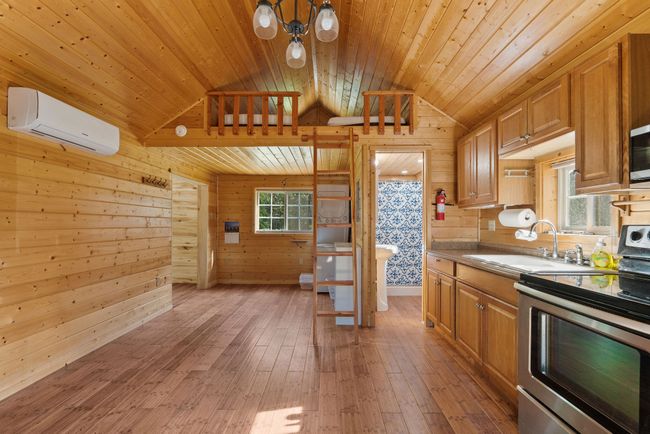 Main living space of guest house with a loft | Image 57