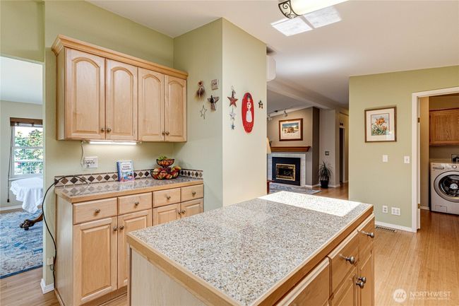 Island with granite countertop. | Image 16