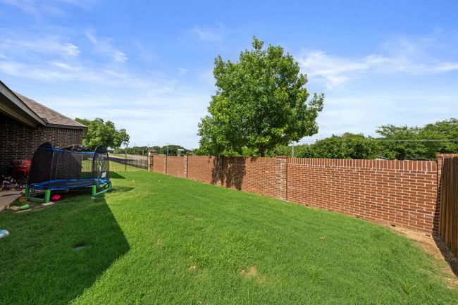 View of yard featuring a trampoline | Image 24