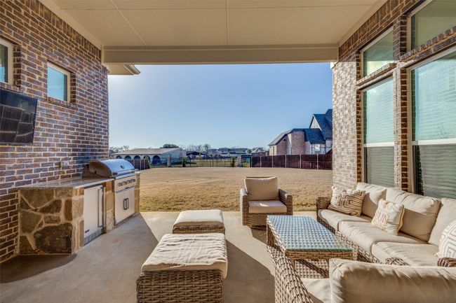 View of patio / terrace with an outdoor kitchen, outdoor lounge area, and grilling area | Image 34