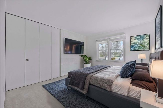 Carpeted bedroom with a closet. Furniture Digitally Staged | Image 5