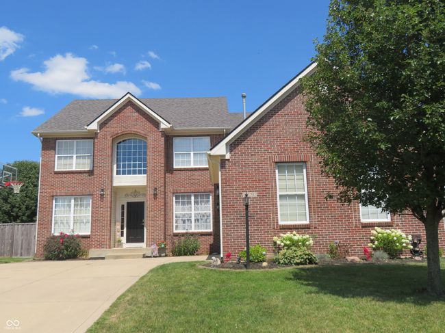 View of front of house with brick siding and a shingled roof | Image 37