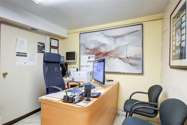 Office with tile patterned floors and baseboards | Image 9
