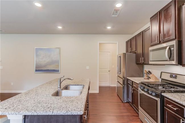 6841 Lancaster Xing, House other with 4 bedrooms, 3 bathrooms and 4 parking in Flowery Branch GA | Image 14