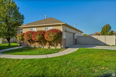 View of side of property with a yard and a garage | Image 3