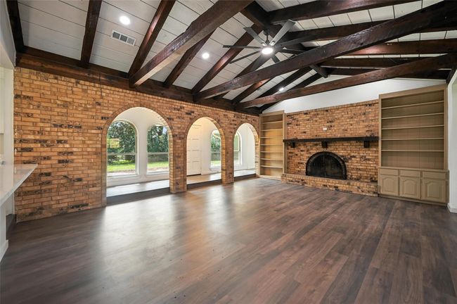 The living room feels grand with the vaulted ceilings. | Image 4