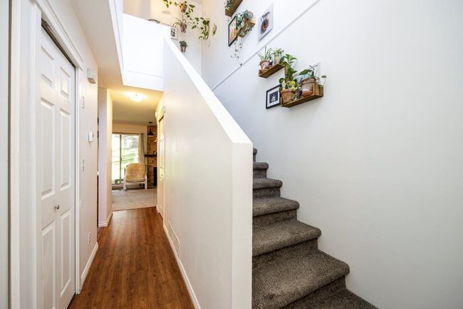 Stairs featuring baseboards and wood finished floors | Image 9