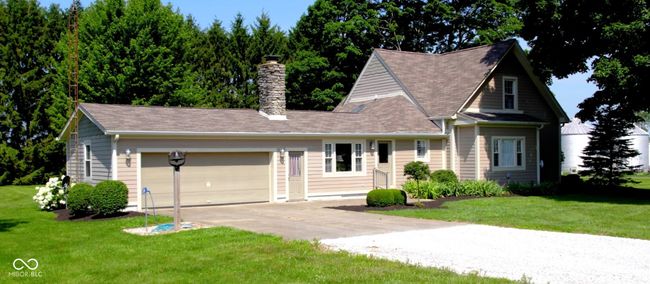 East side view of house and garage. | Image 72
