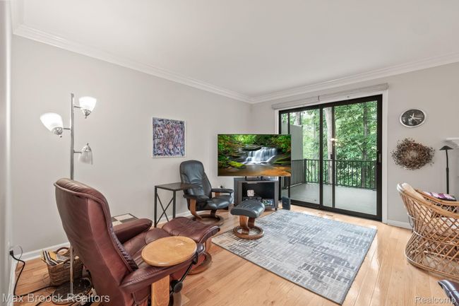 Living room with hardwoods floors/ crown moldings | Image 5