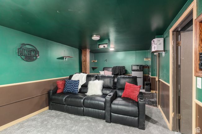 Cinema room with carpet and baseboards | Image 22