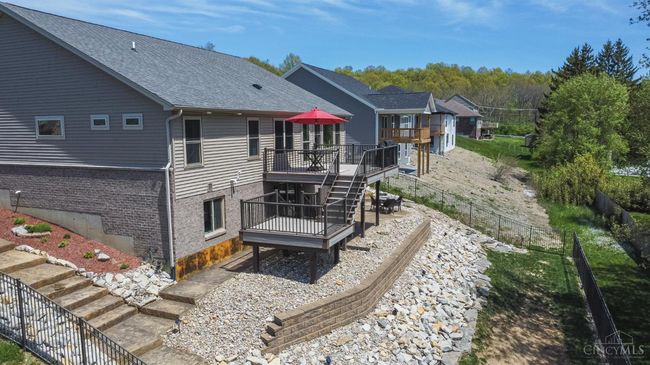 Additional view of rear elevation. Professionally landscaped. Brick wainscoting elevation. | Image 39