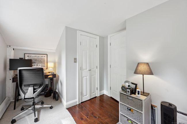 Upper level bedroom with office area. | Image 20