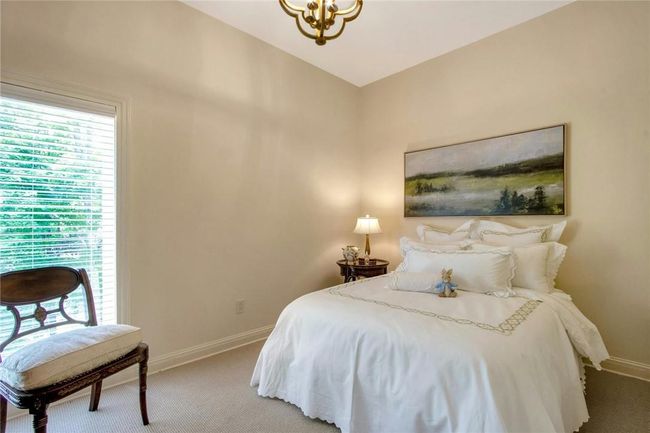 Bedroom featuring carpet floors and a chandelier | Image 23