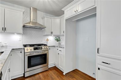 Gas stove, brand new cabinets and cool hood! | Image 3