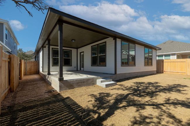 Rear view of house with a fenced backyard | Image 33