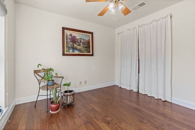 Bedroom 3 with ceiling fan and dark wood-type flooring | Image 23