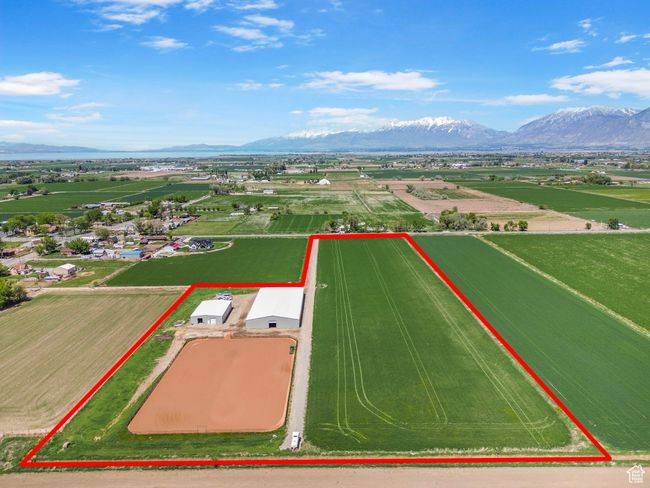 Aerial view of property's location with property boundaries highlighted and mountains | Image 32