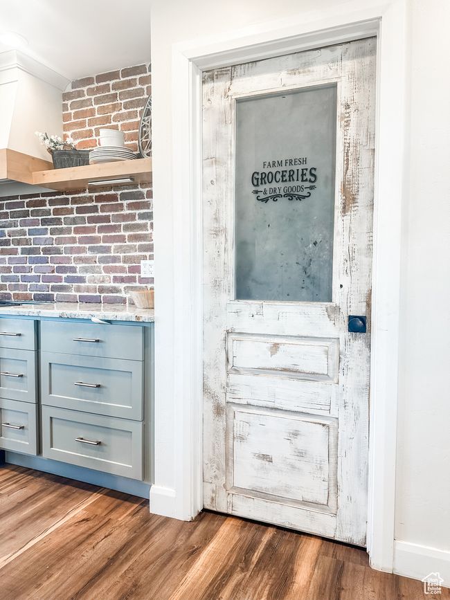 Interior details with baseboards and wood finished floors | Image 11