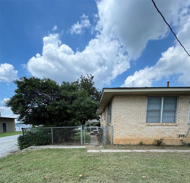 Back of Unit A with small fenced yard. | Image 19