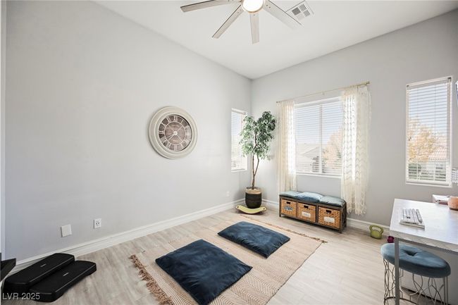 Bedroom featuring visible vents, baseboards, a ceiling fan, and plenty of natural light | Image 48