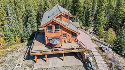 Side view of house featuring wraparound deck | Image 1