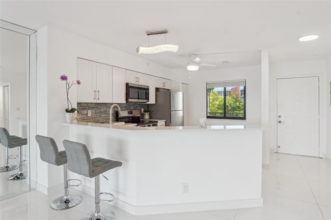 Open floor plan from kitchen into dining room. Excellent for entertaining | Image 11