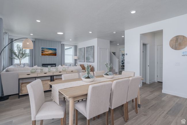 Dining space with light wood finished floors and recessed lighting | Image 22