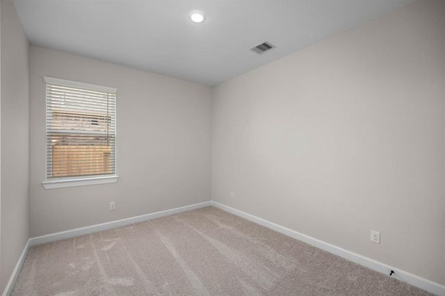 Welcome to the secondary bedroom. It is a comfortable retreat with ample space for relaxation or study. | Image 6
