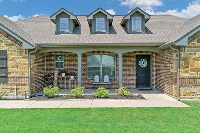 Cape cod home featuring a front yard | Image 2