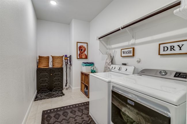 Clothes washing area featuring laundry area, light tile patterned floors, recessed lighting, baseboards, and washing machine and dryer | Image 32