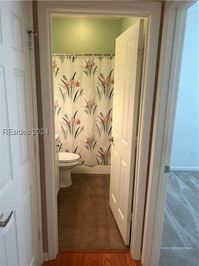 Bathroom with walk in shower, toilet, and tile patterned​​‌​​​​‌​​‌‌​‌‌​​​‌‌​​‌‌​‌​​​​​‌ floors | Image 26