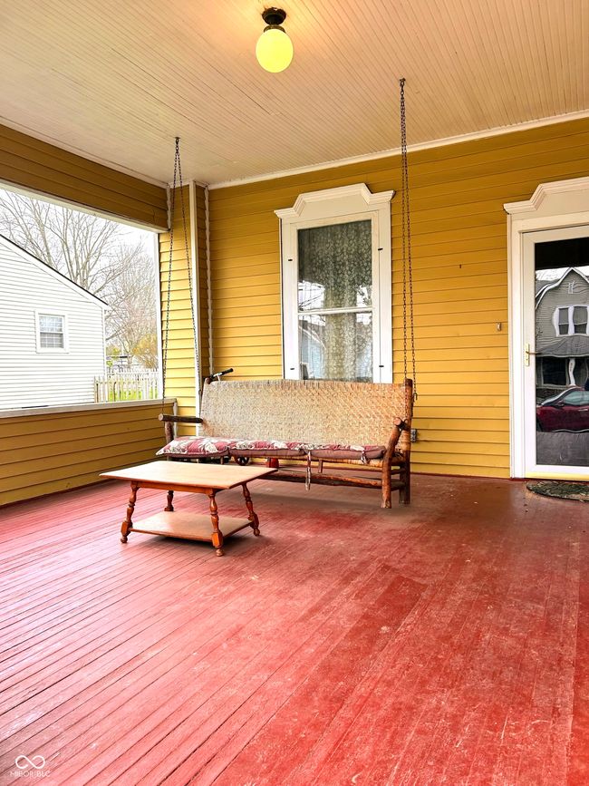wooden deck with a porch | Image 6