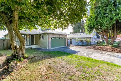 Attractive home built in 1995! Roof in good shape - not that old. Also note the covered front porch! | Image 3