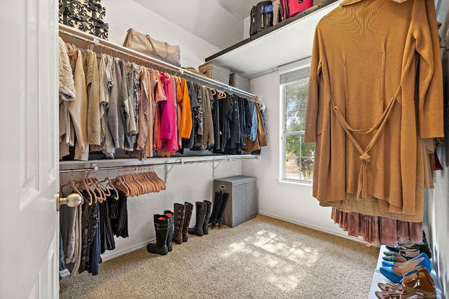 Walk in closet with carpet flooring | Image 21