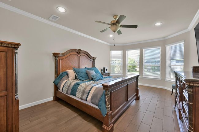 If you're wanting a LARGE 17 X 13 primary retreat featuring bay windows, crown molding, and tile floors... you're in luck. This home is so PERFECT you may even want to go ahead and schedule that showing. | Image 15