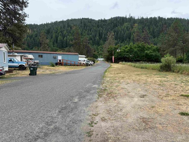 View of asphalt road featuring a wooded view | Image 18