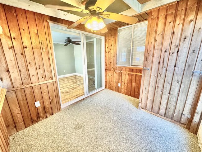 Screened porch with storage closet. Door to outside and glass door to living room | Image 23