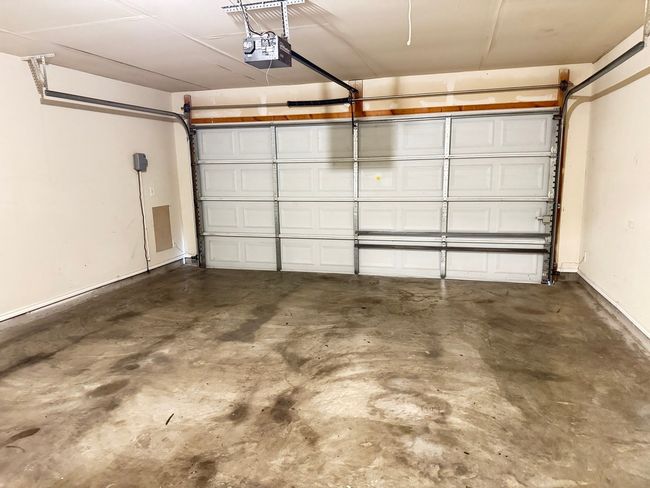 Garage featuring a garage door opener | Image 26