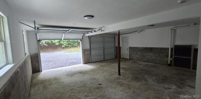 Garage featuring concrete block wall | Image 20