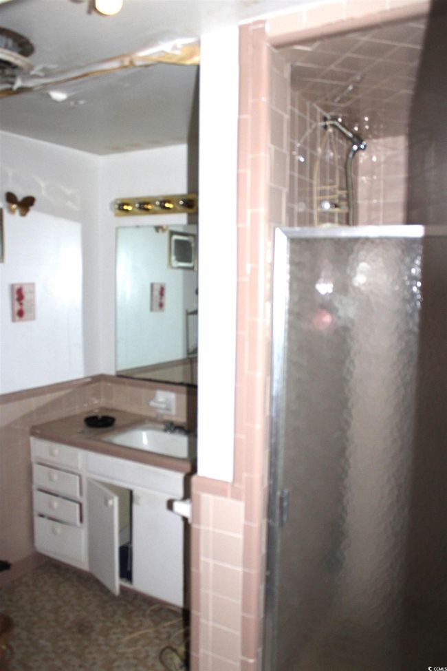 Bathroom with a stall shower and vanity | Image 19