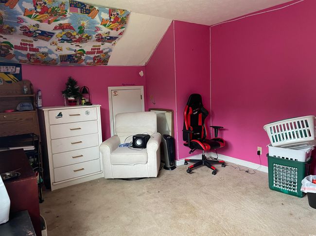 Bedroom featuring carpet floors and lofted ceiling | Image 27