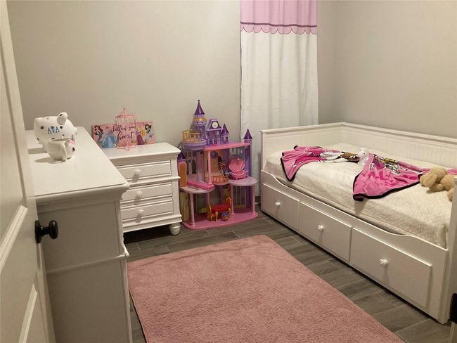 Bedroom featuring wood finish floors | Image 12