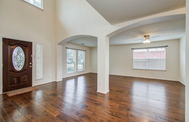 this space in the front of the home can be used for formal living/dining or children's play area or home office. | Image 6