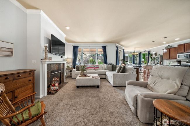Nice size family room- great gathering place to still all be together with the chef in the kitchen. | Image 5