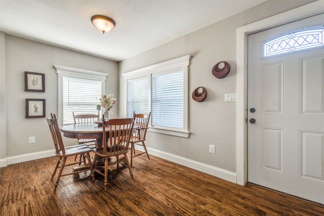 Bright and cozy eat in dining area is surrounded by windows—perfect for morning coffee or casual meals before advancing to our spacious backyard deck. | Image 12