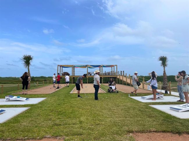 Seahorse Estates was built for connection—this vibrant shot captures residents and guests enjoying the amenity deck, from families playing bocce to friends tossing bags. With no short-term chaos and just 49 homes total, this community is designed for easygoing, elevated beach life. | Image 11