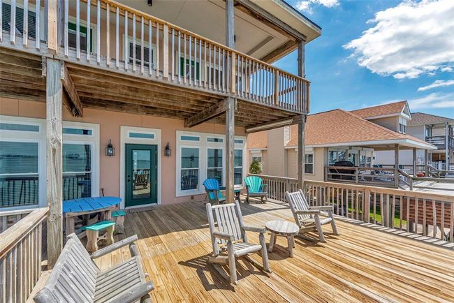 The space comes with Adirondack chairs, a picnic table, and a built-in bench, all set up so you can make the most of being right on the water. | Image 38